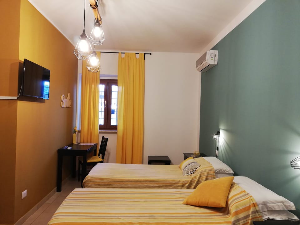 Double or Twin Room | Down comforters, desk, laptop workspace, blackout drapes