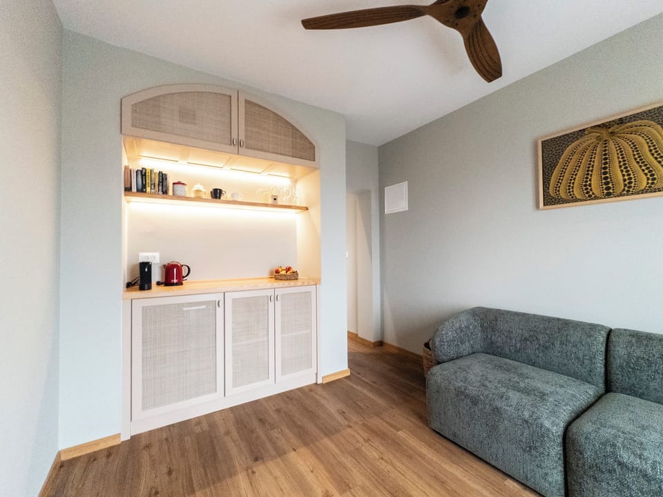 Deluxe Apartment, Balcony, City View | Living area | Flat-screen TV