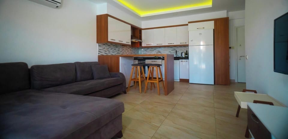 Sweet Home Apartments B | Living area | 55-inch LCD TV with satellite channels