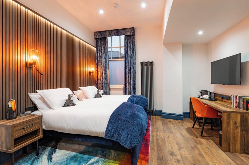 Deluxe Studio Suite, 2 Twin Beds | In-room safe, desk, laptop workspace, blackout drapes