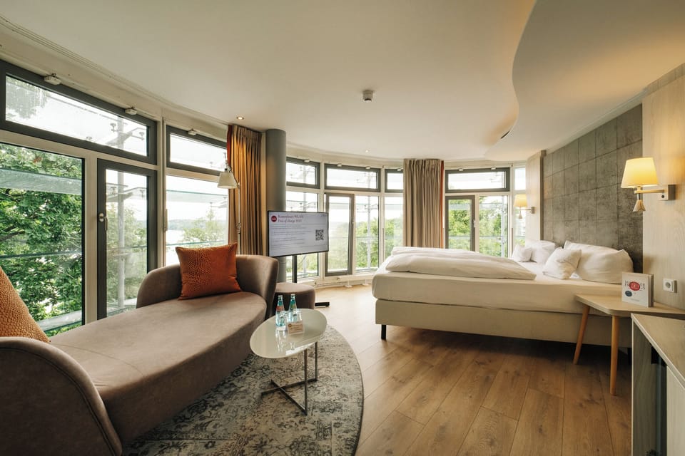 Deluxe Suite, Lake View | Hypo-allergenic bedding, desk, laptop workspace, blackout drapes