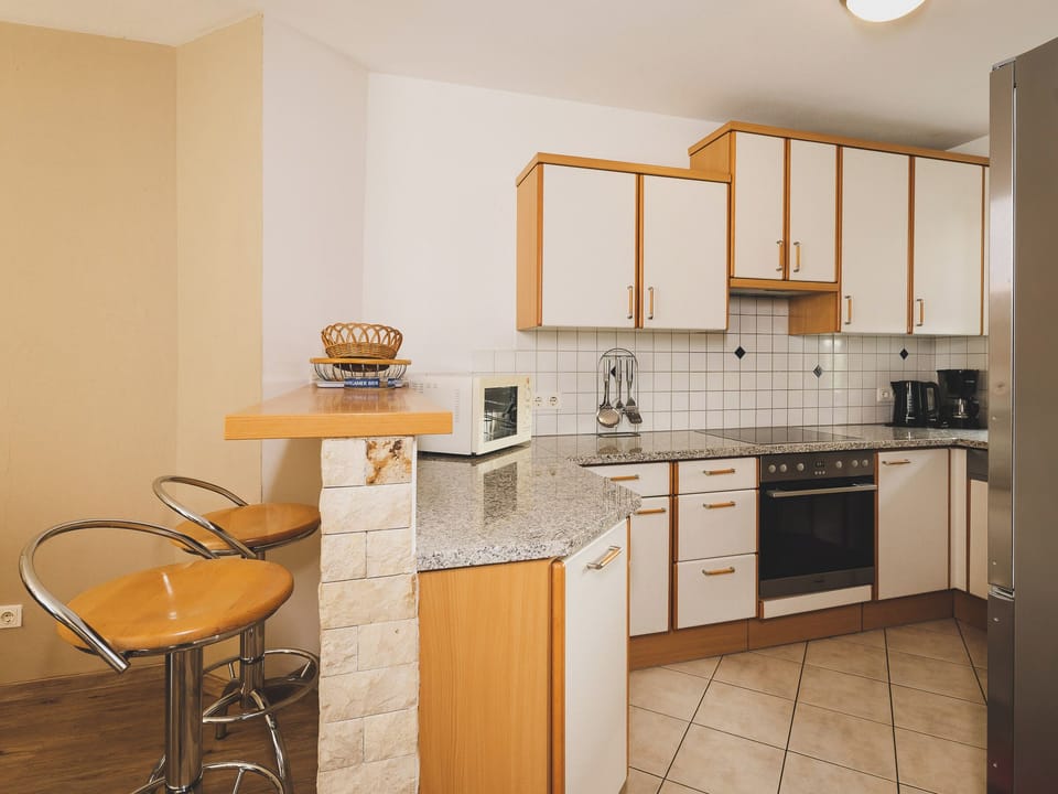 Deluxe Chalet, Mountain View | Private kitchen | Highchair