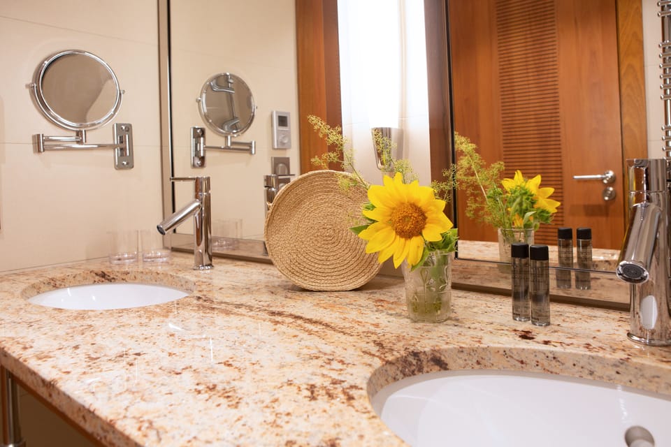 Superior Double Room, 3 Bedrooms | Bathroom | Shower, rainfall showerhead, free toiletries, hair dryer
