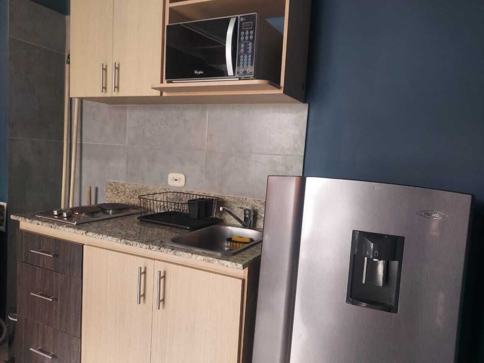 Microwave, stovetop, blender, cookware/dishes/utensils