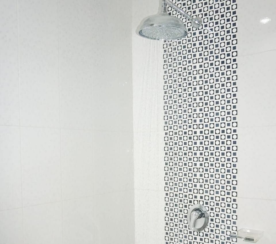 Deluxe Twin Room, City View | Bathroom | Hair dryer, slippers, towels, soap