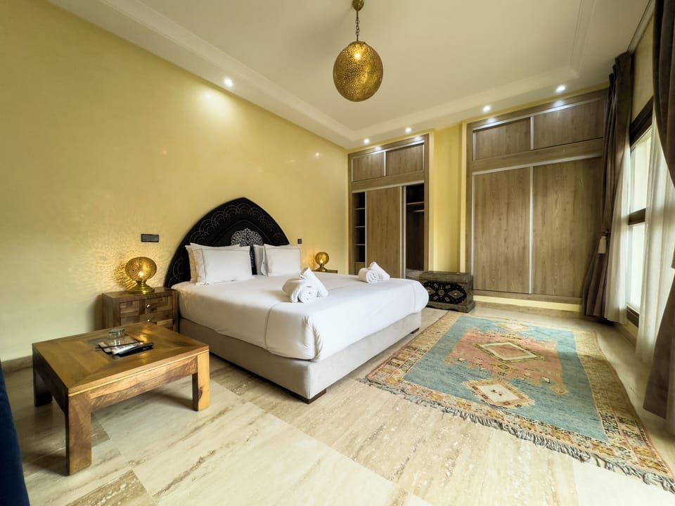 Superior Suite, Courtyard View | Minibar, in-room safe, iron/ironing board, free WiFi