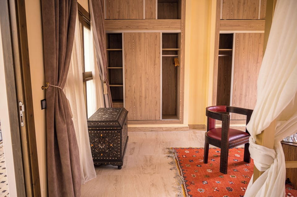Luxury Suite, Courtyard View | Minibar, in-room safe, iron/ironing board, free WiFi