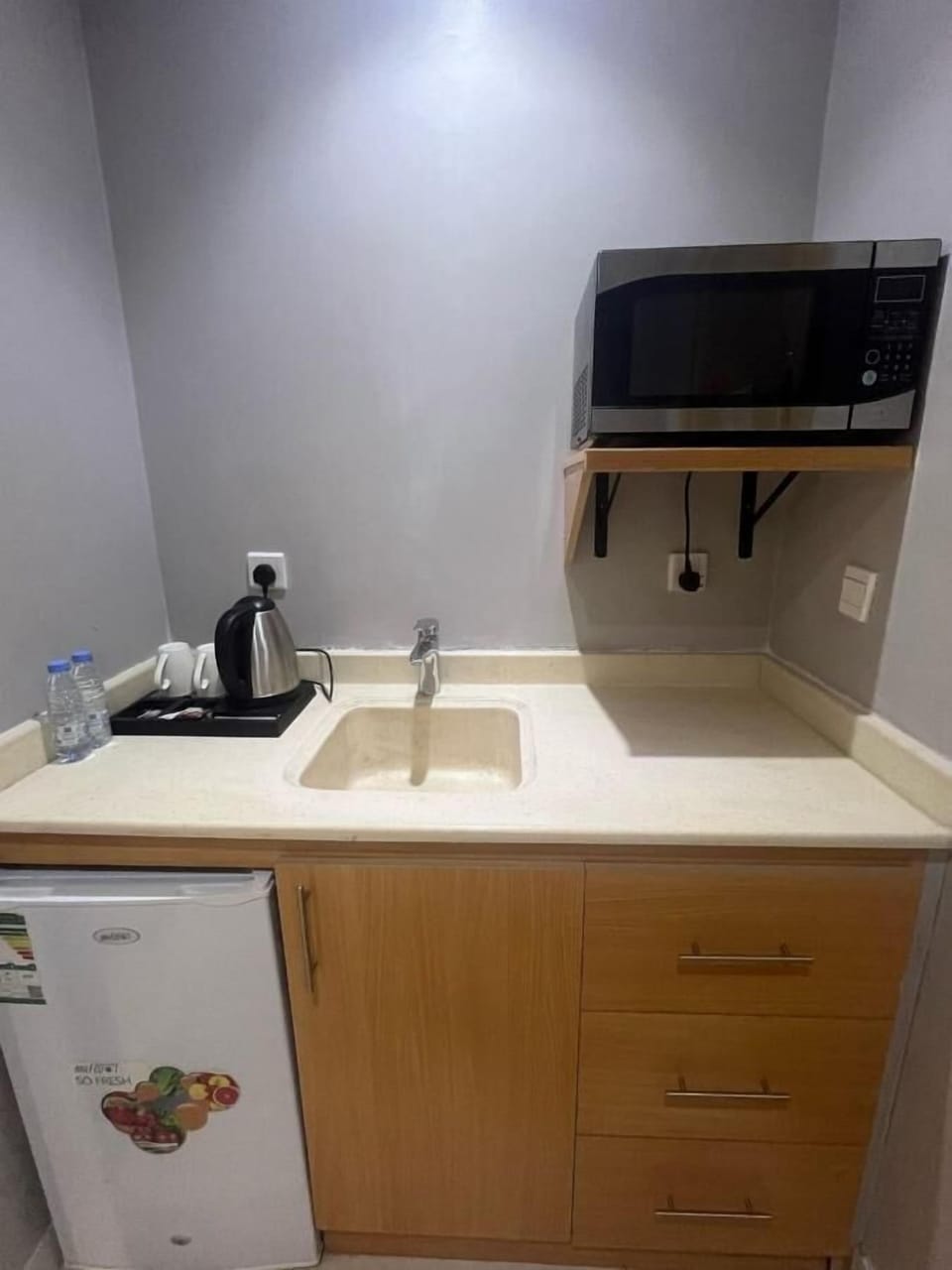 Mini-fridge, microwave, stovetop, cookware/dishes/utensils