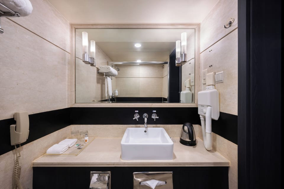 Standard King Room | Bathroom | Shower, designer toiletries, hair dryer, bathrobes
