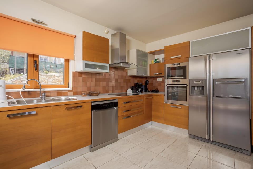 Apartment, Sea View | Private kitchen | Full-size fridge, microwave, oven, stovetop