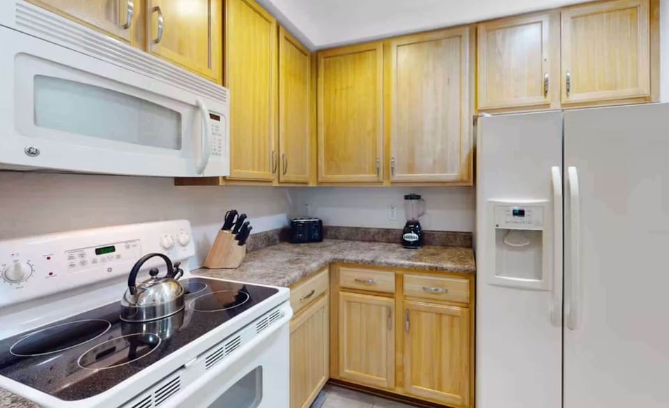 Condo, Multiple Beds, Balcony, Garden View (Sunny Haven At Caribe Cove) | Private kitchen | Fridge, microwave, oven, stovetop