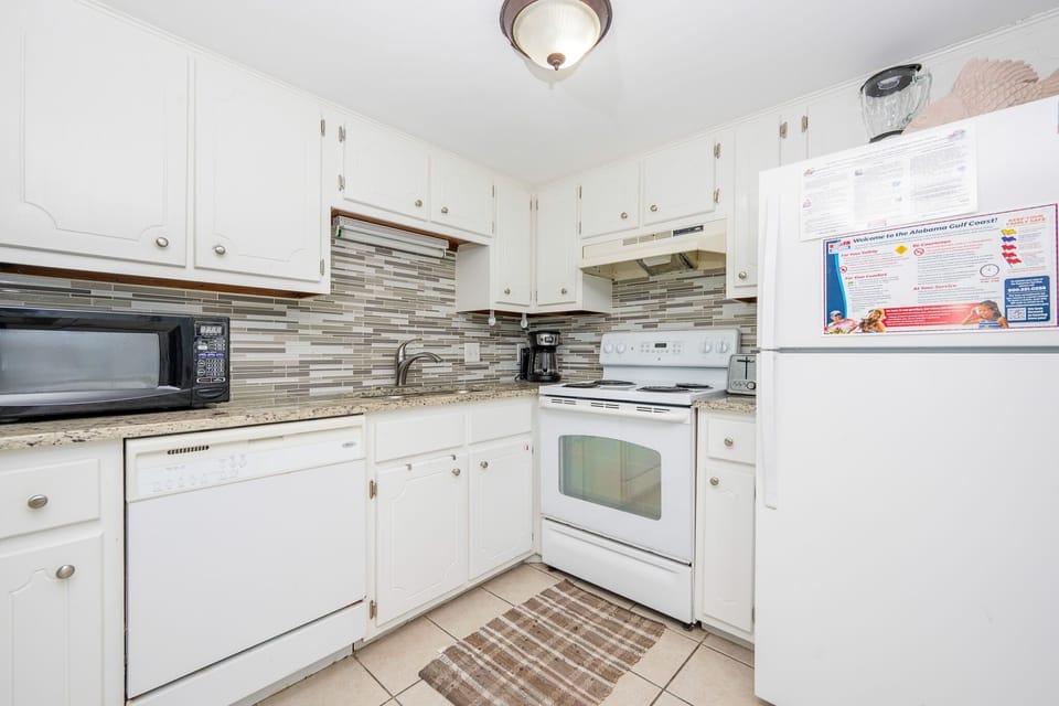 Condo, 2 Bedrooms | Private kitchen | Coffee/tea maker, fridge, oven