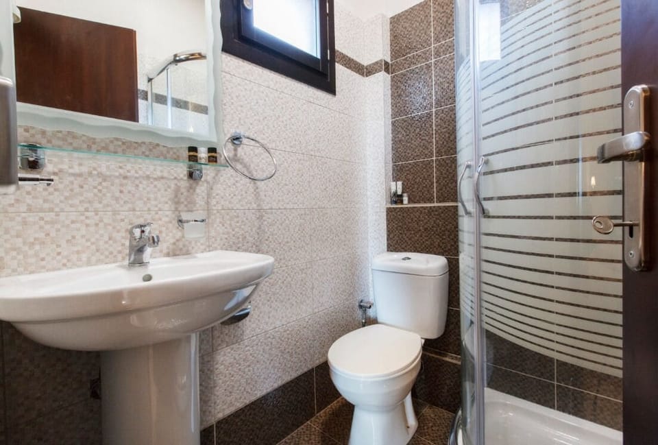 Double Room, Courtyard View | Bathroom | Shower, hair dryer, towels, soap