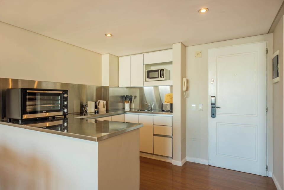 Family Apartment, River View | Private kitchen | Microwave, oven, stovetop, coffee/tea maker