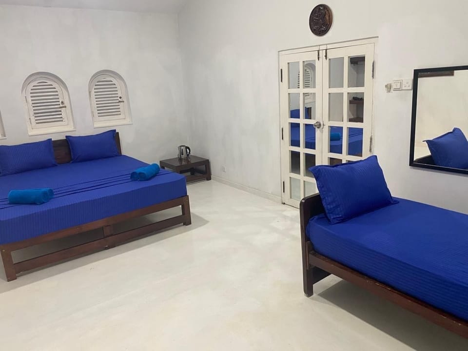 Classic Triple Room, Ocean View | Iron/ironing board, WiFi (free)