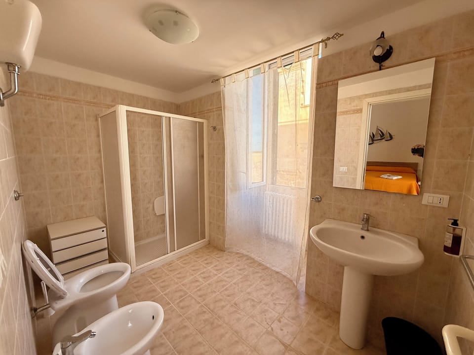 Superior Quadruple Room, Sea View | Bathroom | Shower, hair dryer, towels, soap