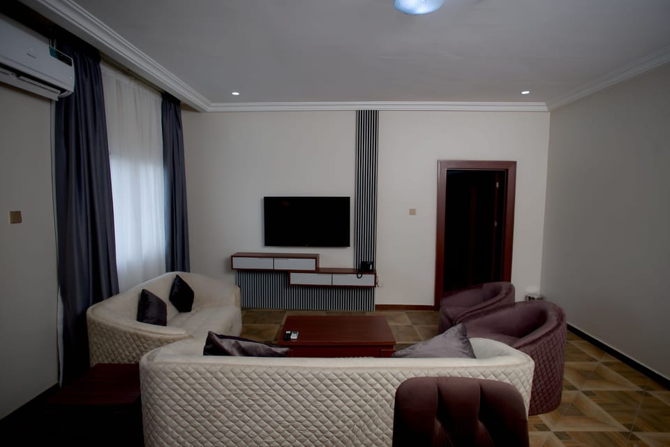 Basic Double Room, Balcony, Pool View | Living area | 50-inch Smart TV with digital channels, first-run movies
