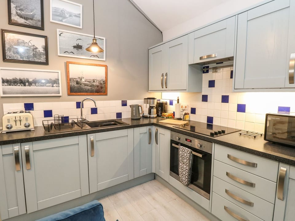 Fridge, microwave, toaster, cookware/dishes/utensils