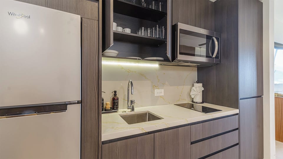 Deluxe Condo, Balcony, Ocean View | Private kitchenette | Coffee/tea maker