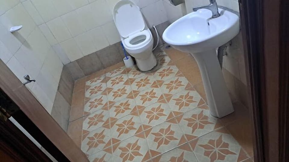 Shower, slippers, towels, soap
