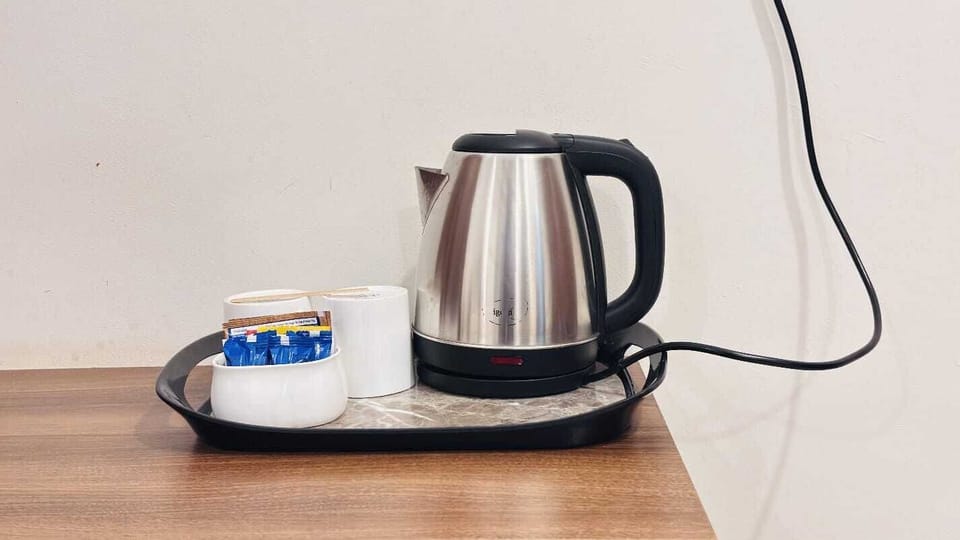 Deluxe Room, Balcony, Garden View | Coffee and/or coffee maker