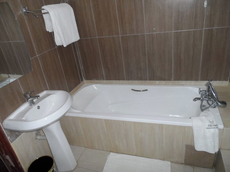 Double Room, City View | Bathroom | Shower, slippers, towels, soap