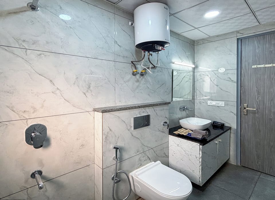 Studio, City View | Bathroom | Shower, free toiletries, slippers, towels