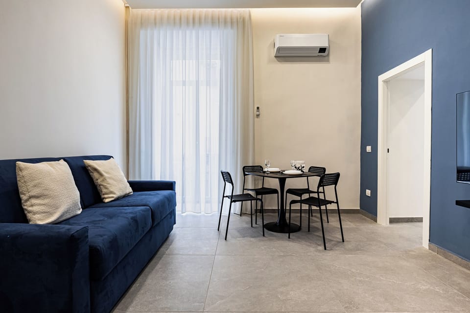Deluxe Quadruple Room, 1 King Bed with Sofa bed, Kitchen | Living area | 50-inch Smart TV with satellite channels, Netflix, streaming services