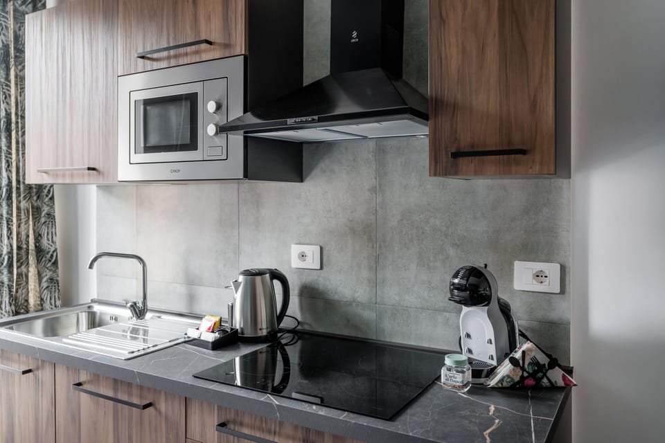 Family Quadruple Room, Balcony, City View | Private kitchen | Fridge, microwave, oven, stovetop