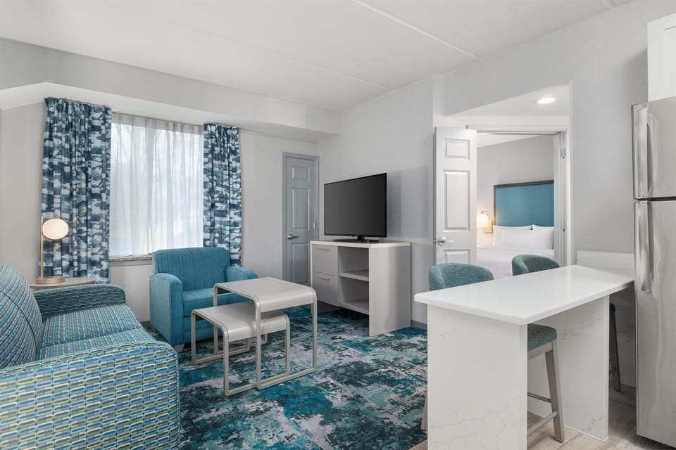 Premier Suite, 2 Bedrooms, 2 Bathrooms | Living area | 37-inch LCD TV with cable channels, TV, DVD player