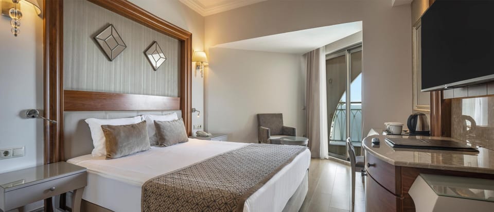 Family Room, 2 Bedrooms, Sea View | Free minibar, in-room safe, desk, free WiFi
