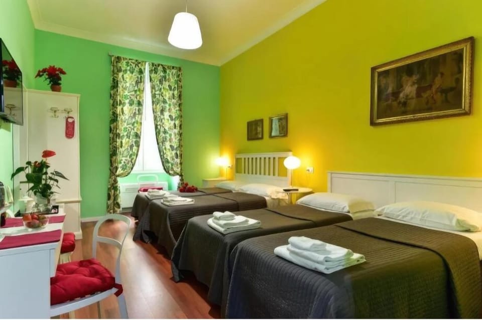Family Triple Room | In-room safe, desk, laptop workspace, blackout drapes