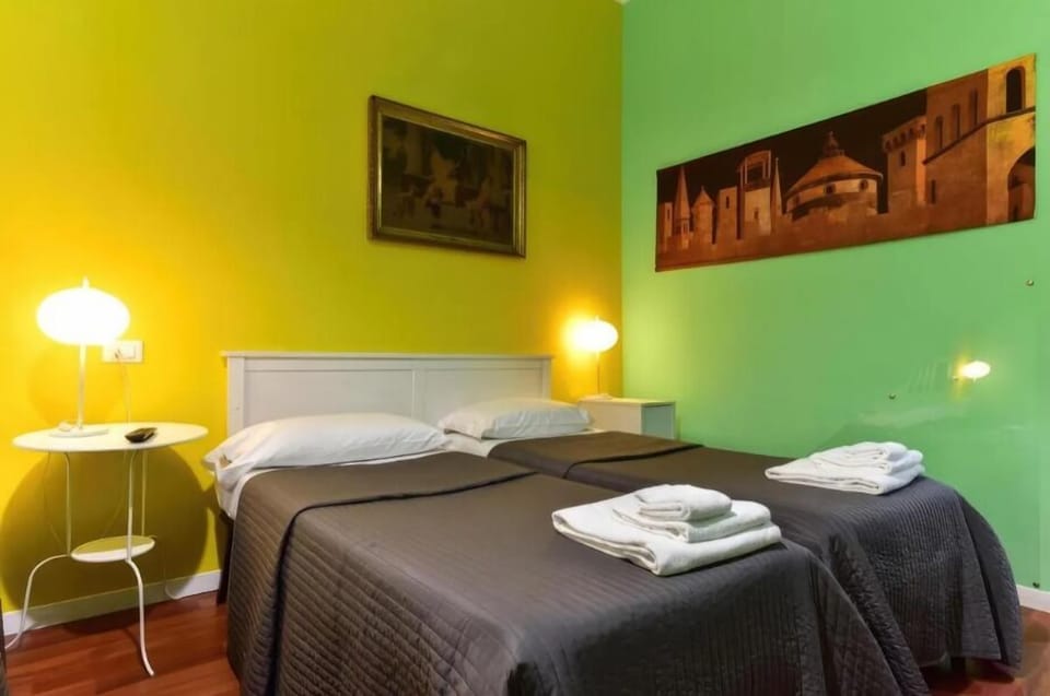 Family Triple Room | In-room safe, desk, laptop workspace, blackout drapes