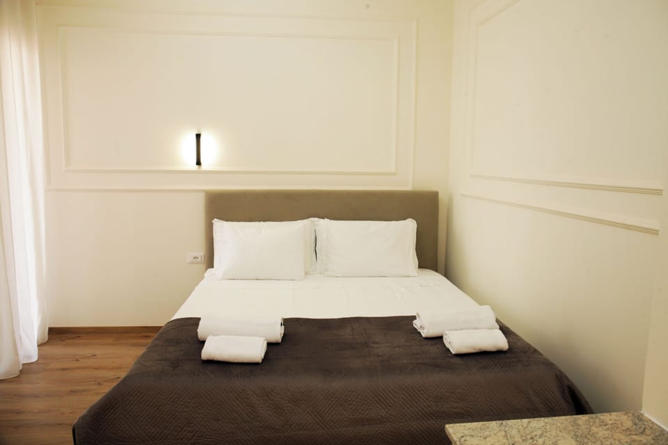 Family Quadruple Room, Balcony, City View | Iron/ironing board, free WiFi