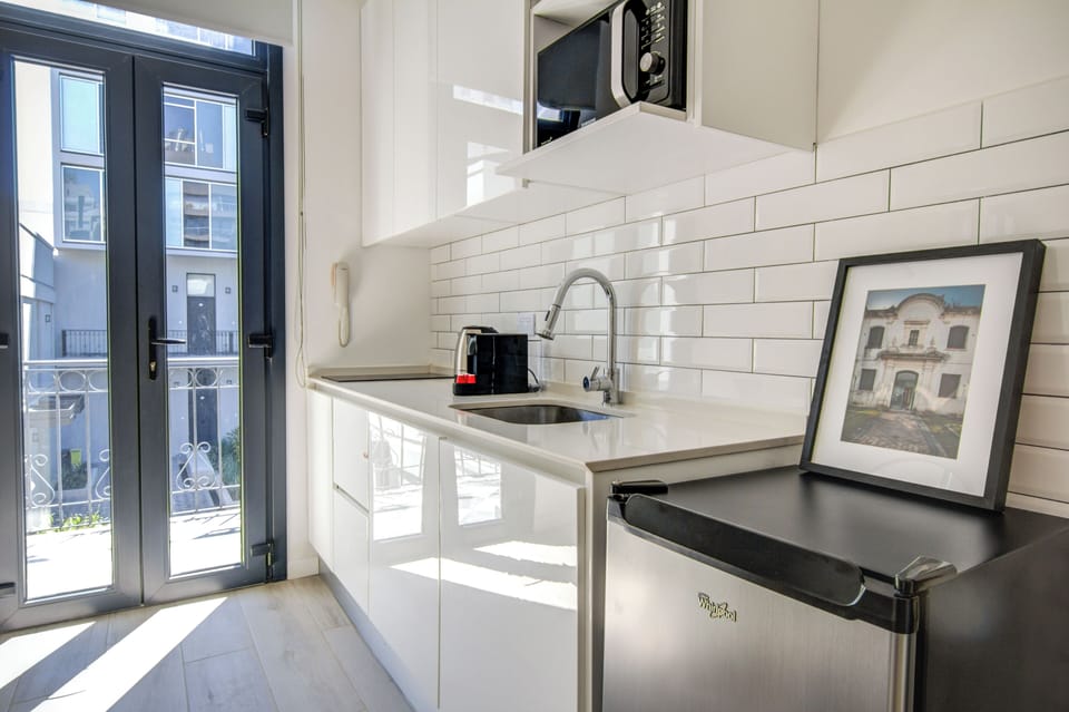 Deluxe Studio, Courtyard View | Private kitchen | Coffee/tea maker, electric kettle