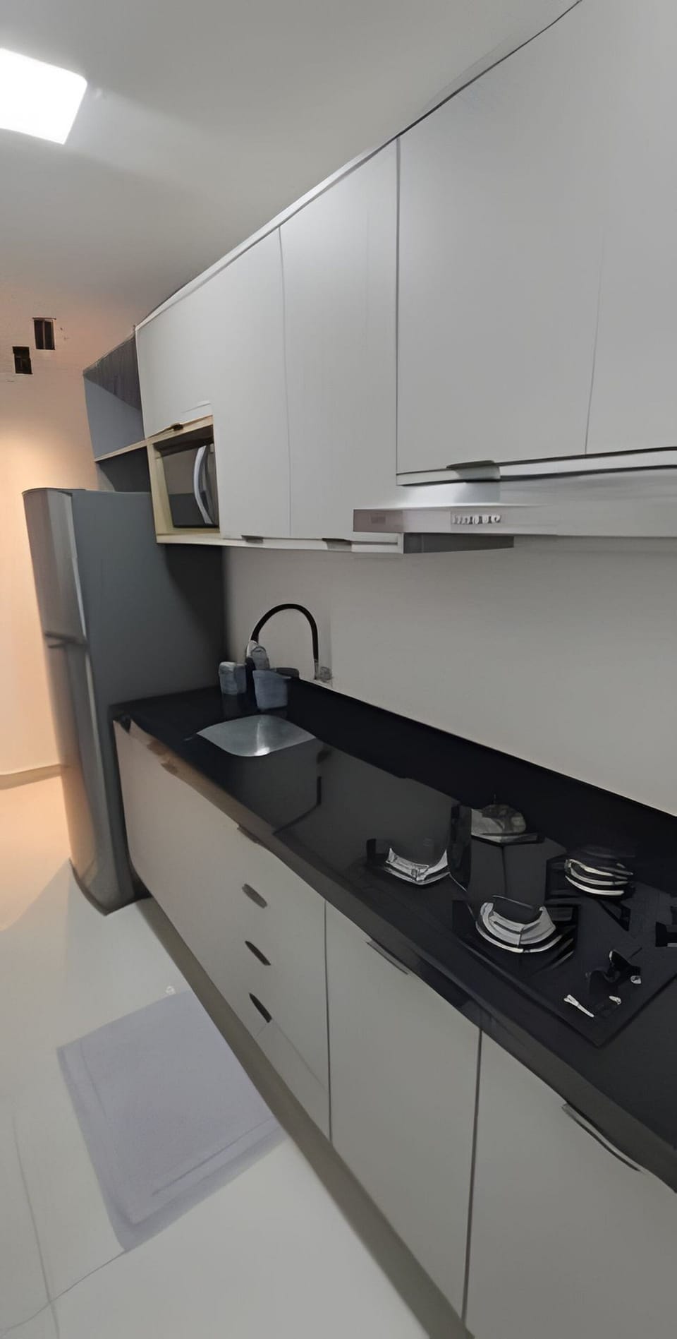 Apartment | Private kitchen | Fridge, microwave, stovetop, cookware/dishes/utensils