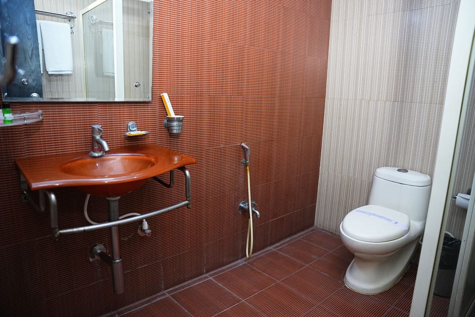 Shower, hair dryer, slippers, towels