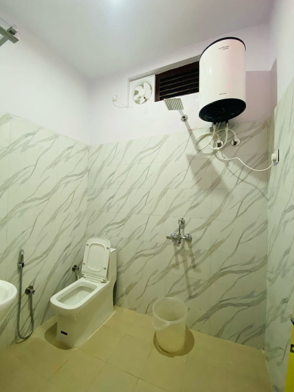 Shower, towels, soap, toilet paper