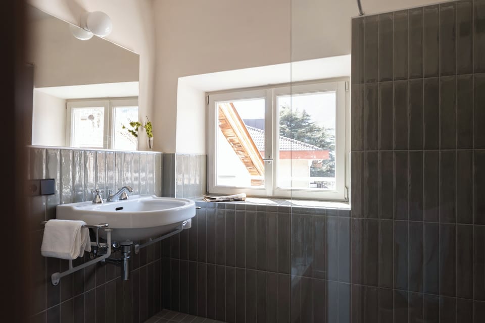 Deluxe Apartment, Mountain View | Bathroom | Hair dryer, slippers, towels, soap
