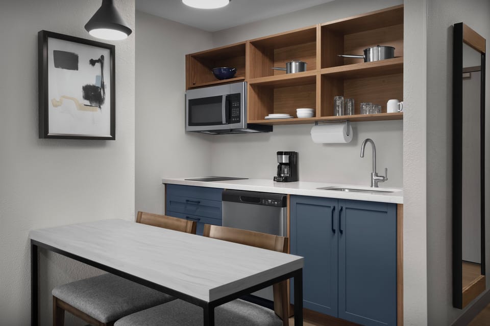 Desk, laptop workspace, blackout drapes, iron/ironing board
