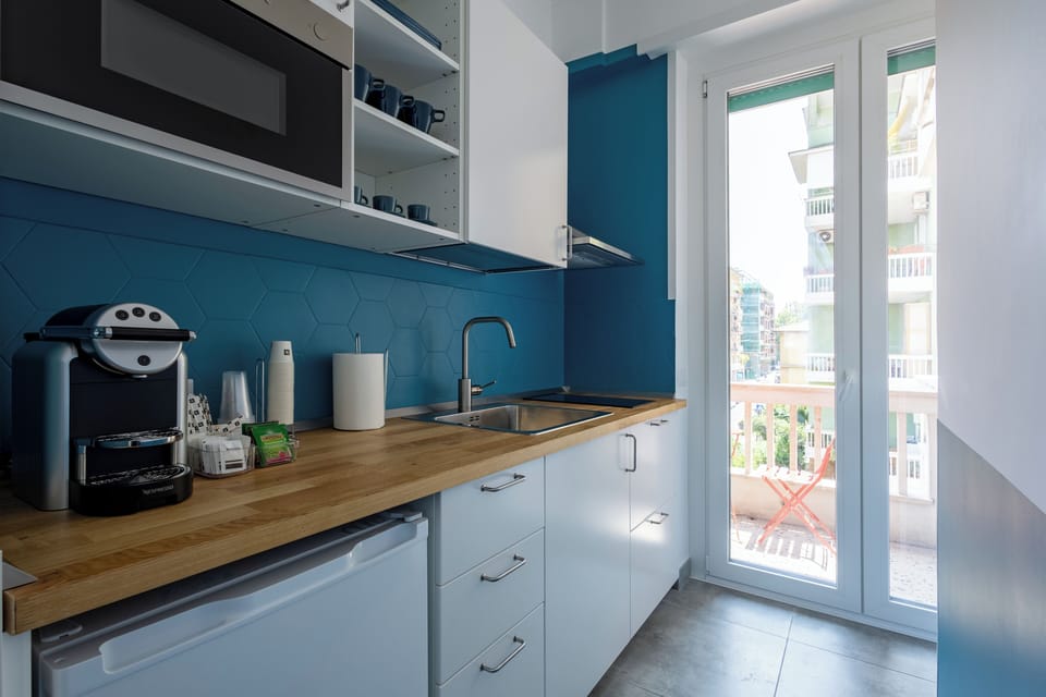 Mini-fridge, oven, stovetop, cookware/dishes/utensils