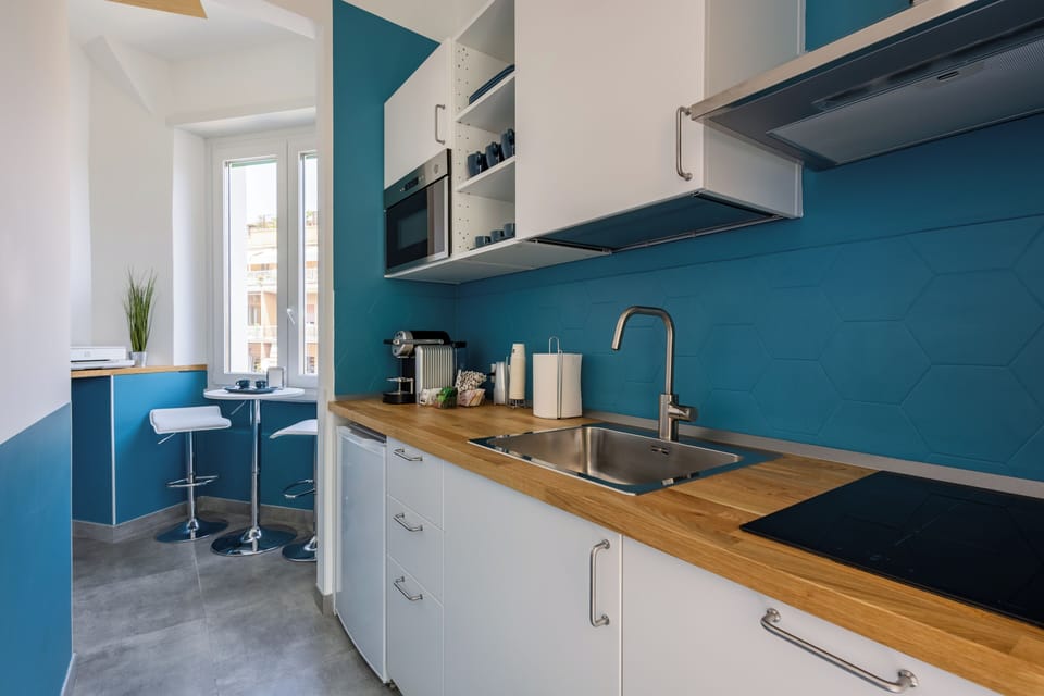 Mini-fridge, oven, stovetop, cookware/dishes/utensils