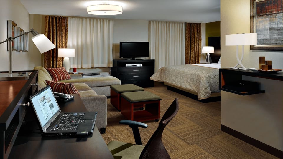 Studio Suite, 1 King Bed, Kitchen | Desk, laptop workspace, blackout drapes, iron/ironing board