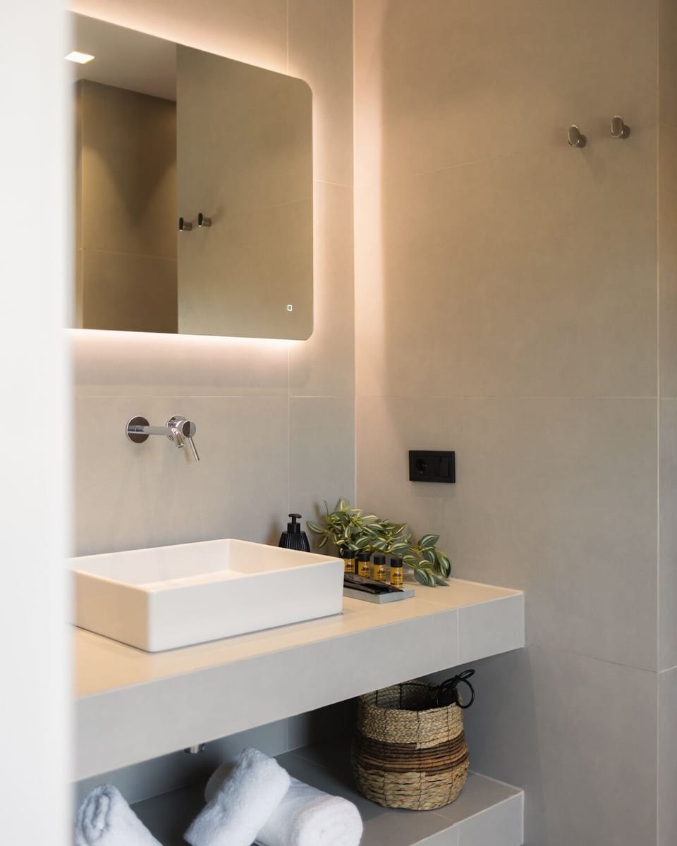Superior Studio Suite, Pool View | Bathroom | Shower, hair dryer, bathrobes, slippers