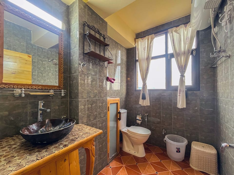 Deluxe Double Room, Balcony, Mountain View | Bathroom | Shower, free toiletries, towels, soap