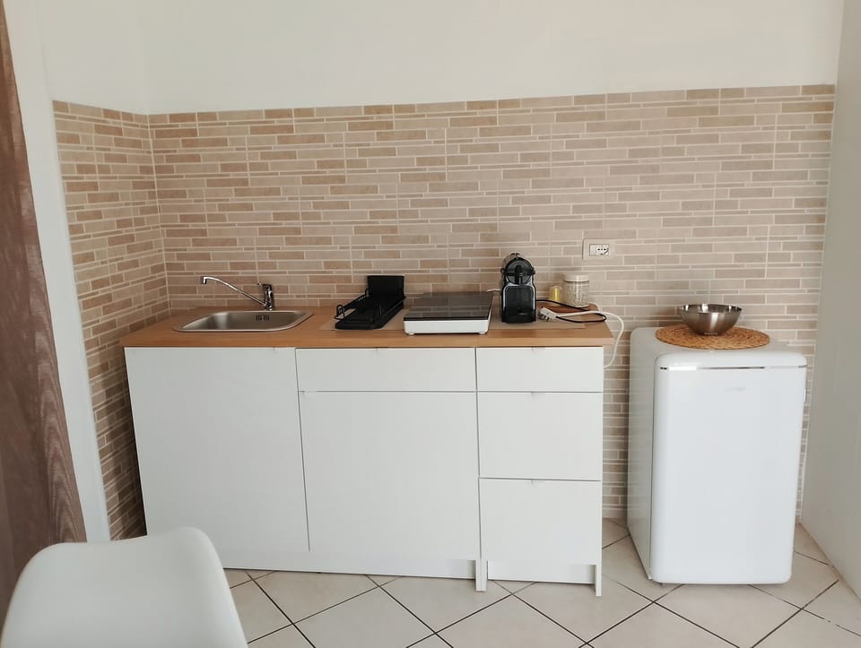 Family Room | Private kitchen | Full-size fridge, microwave