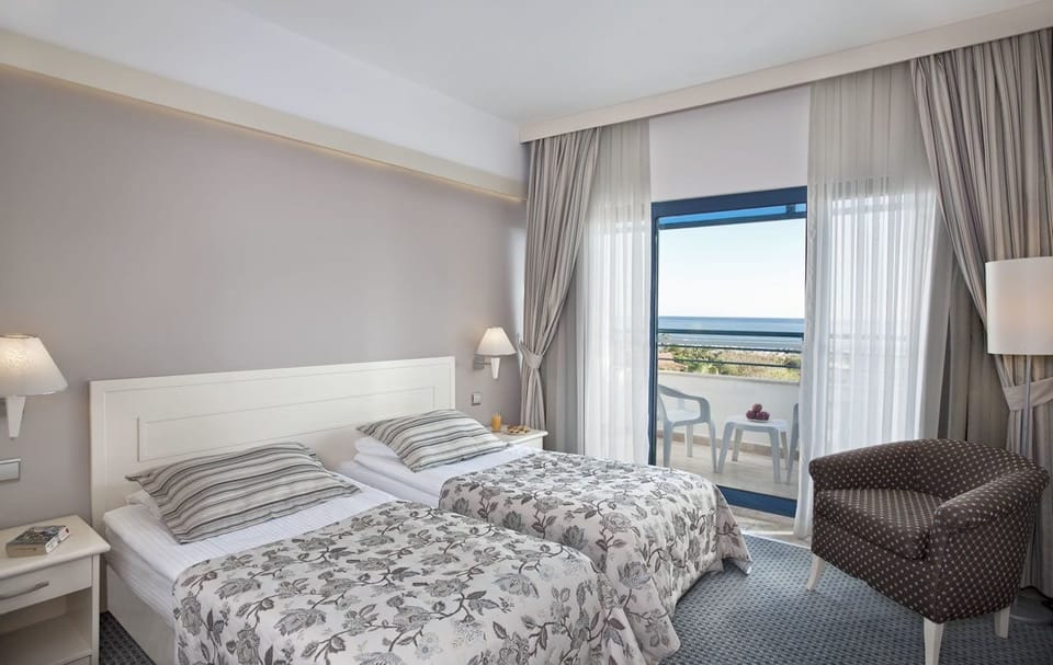 Main Building Sea View Room | Free minibar, in-room safe, desk, free cribs/infant beds
