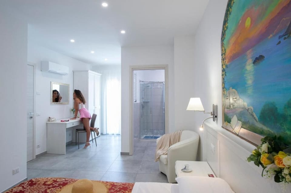 Family Quadruple Room, Balcony, Courtyard View | In-room safe, desk, laptop workspace, blackout drapes