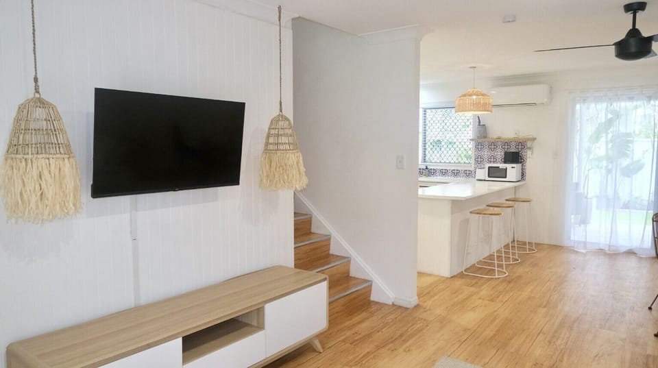 Deluxe Townhome, 3 Bedrooms | Living area | 55-cm Smart TV with digital channels