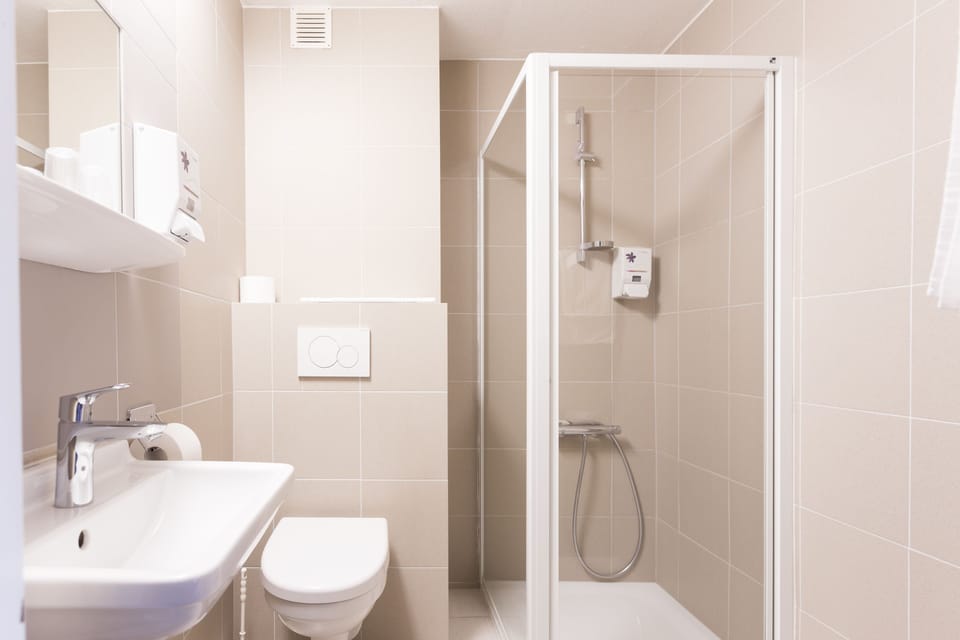 Combined shower/tub, hair dryer, towels, soap